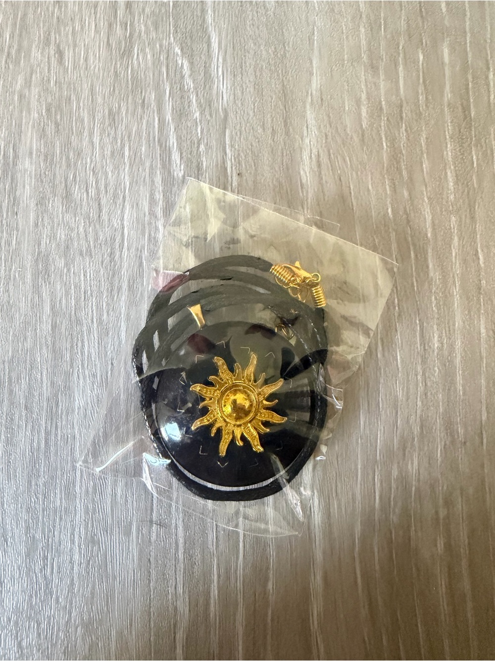 Gold Sun Pendant Black Cord Necklace